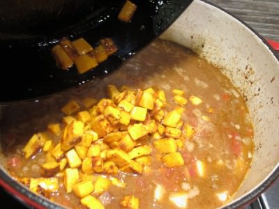 Add browned sweet potatoes to stew