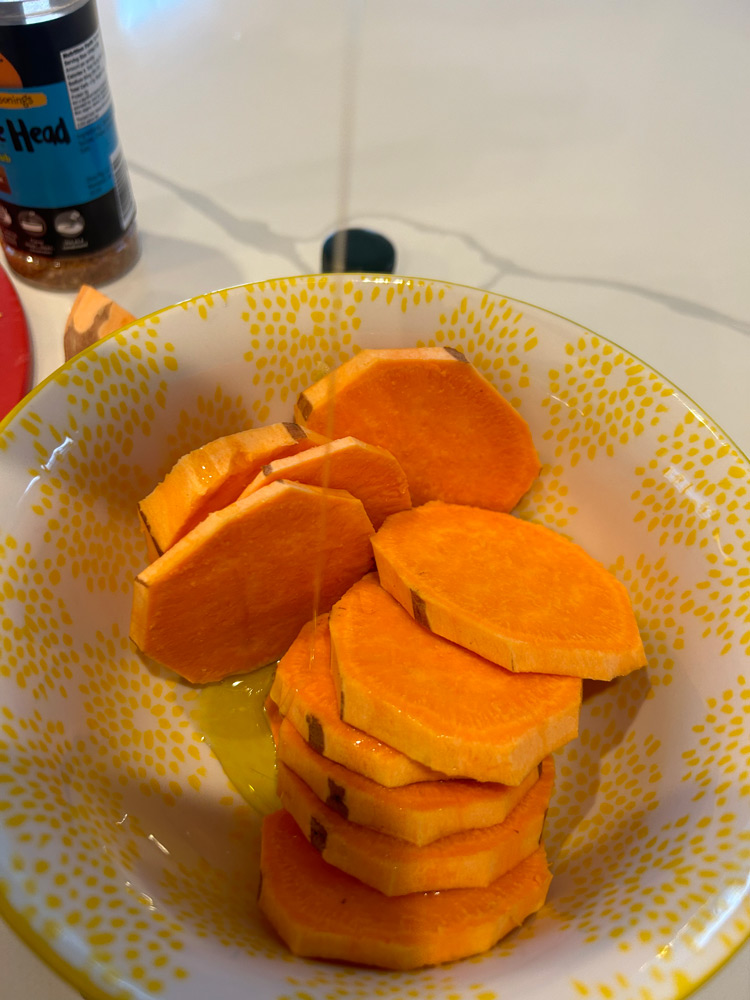 Toss sweet potato slices with oil