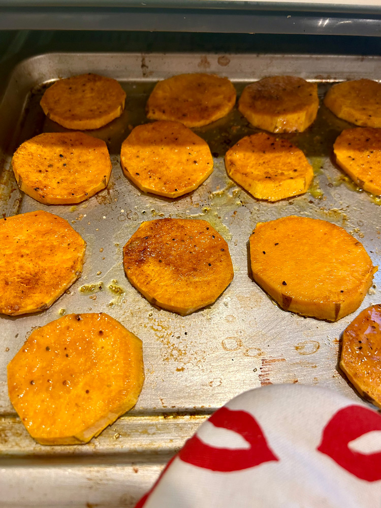 Flip sweet potatoes and cook