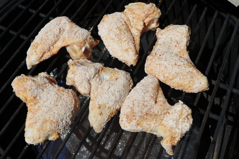 Place wings on oiled grate