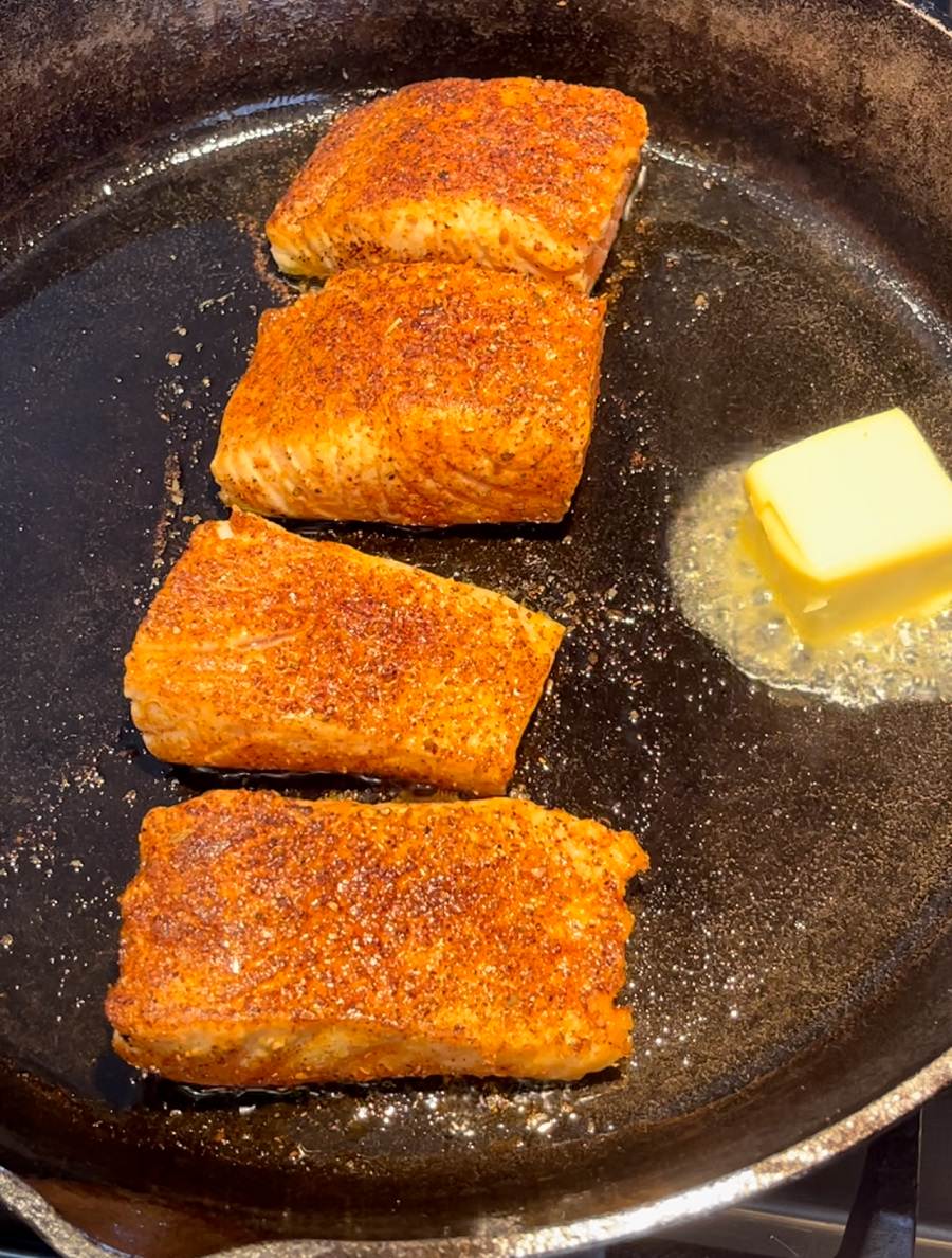 Flip salmon and add butter