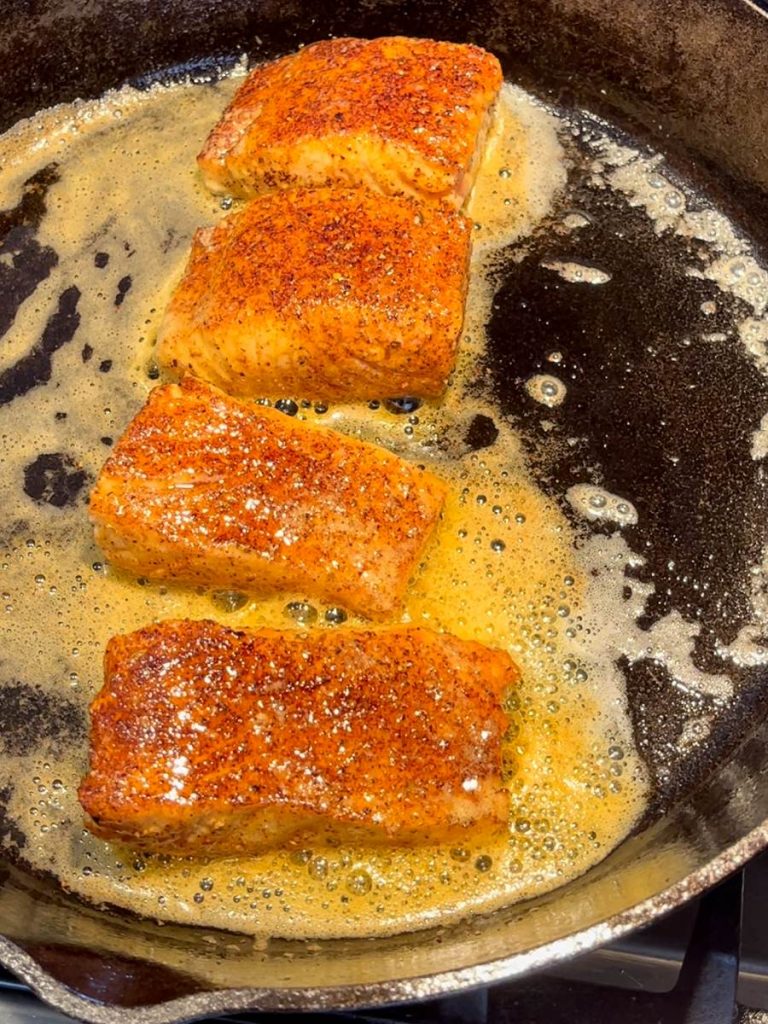 Baste salmon with butter