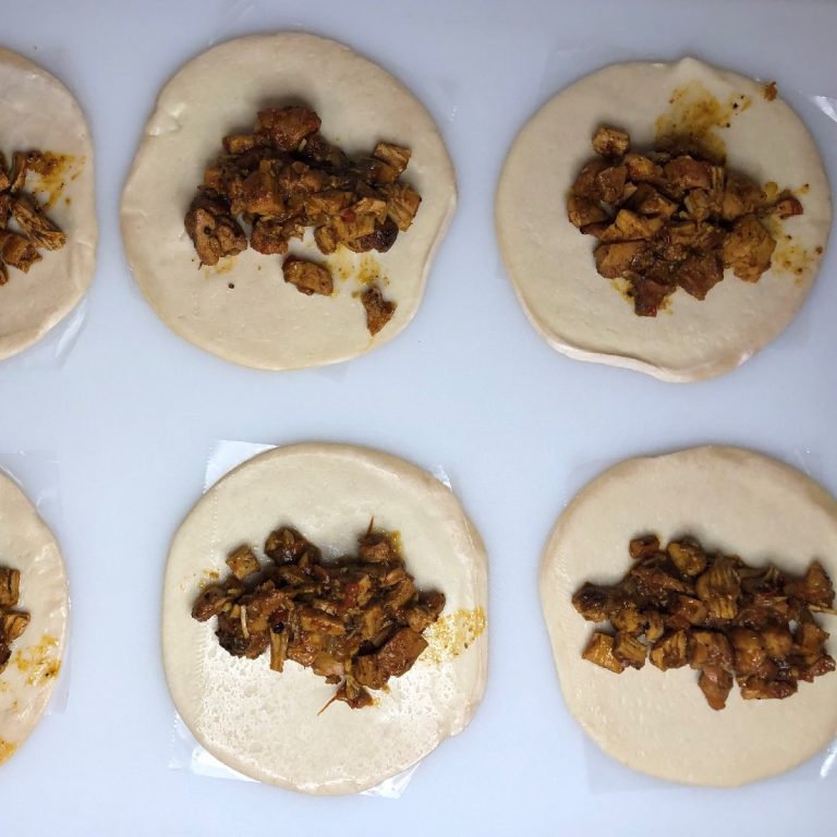 Top each dough disc with filling