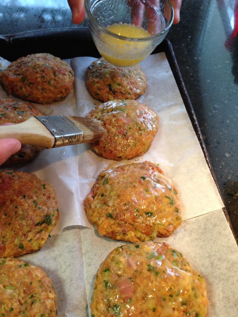 Brush each cake with melted butter and sprinkle with Bayou-ish