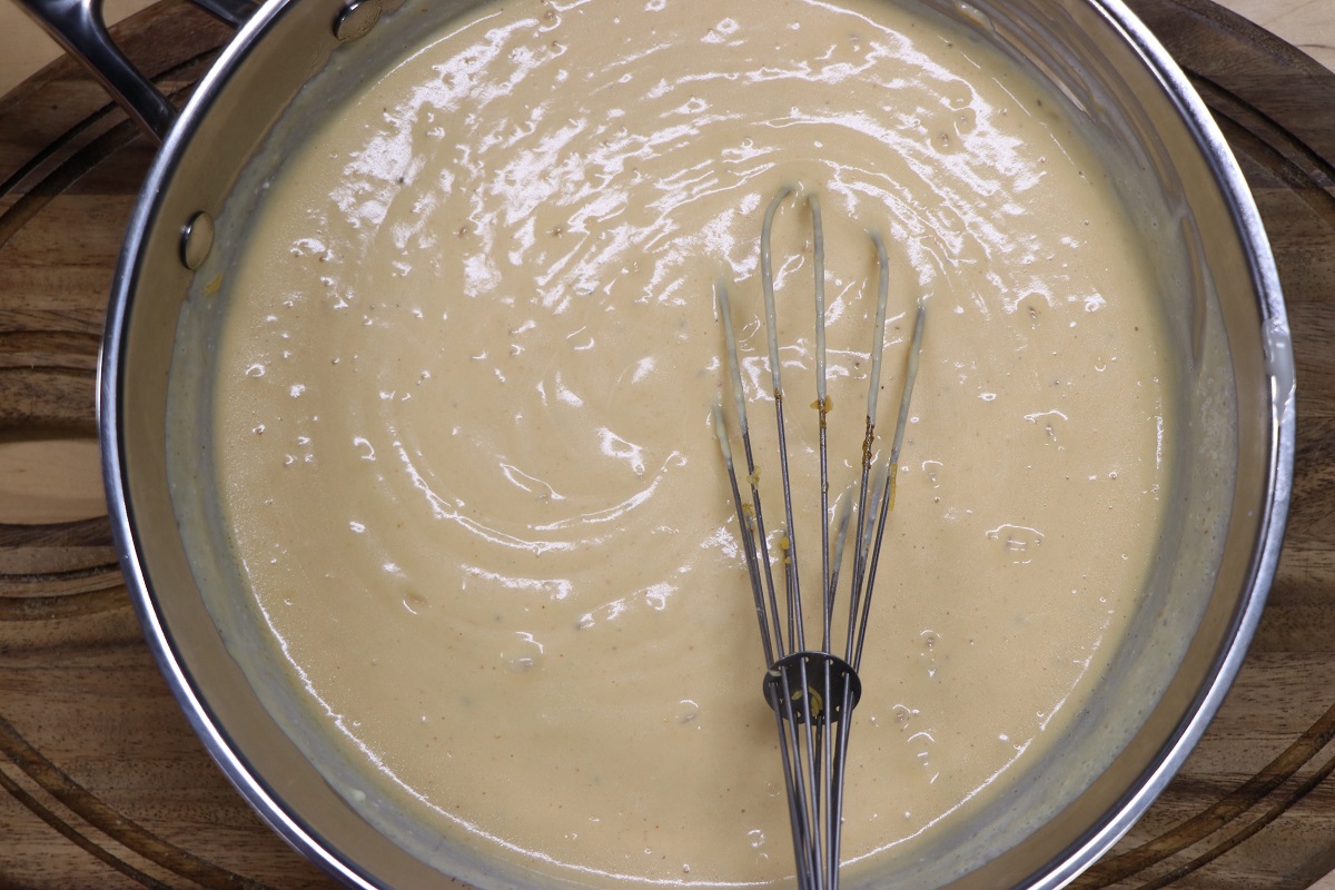 Whisk in mustard and shredded cheese