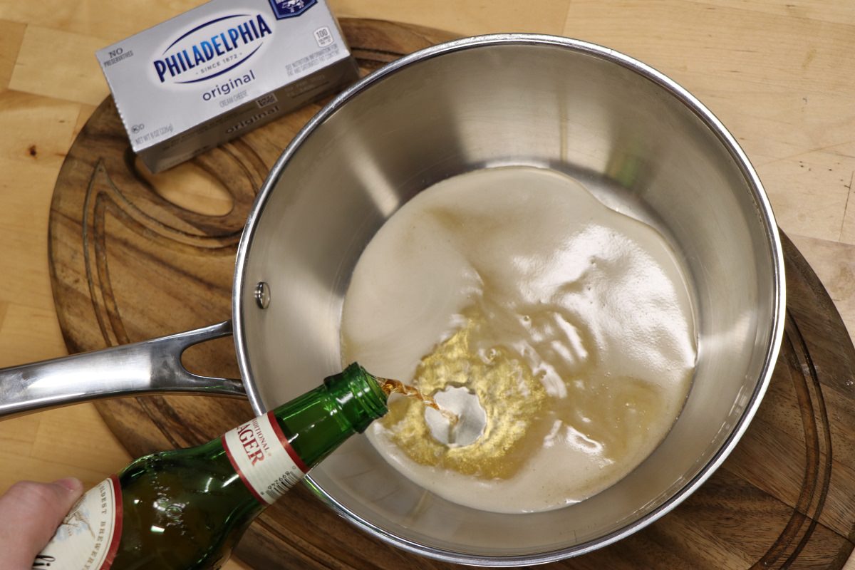 Pour beer into sauce pan
