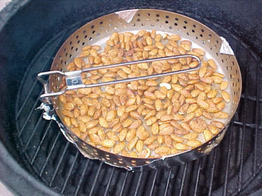 Roast almonds in perforated pan with sides