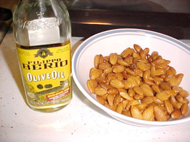 Coat almonds with olive oil