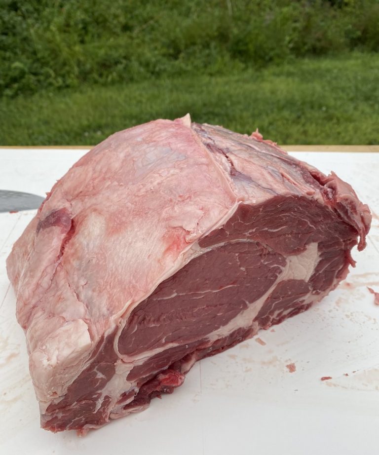 Trim excess fat around the ribeye roast