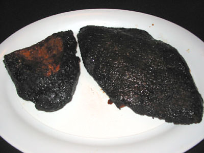 Brisket burnt end has deep dark crust but is moist and tender inside