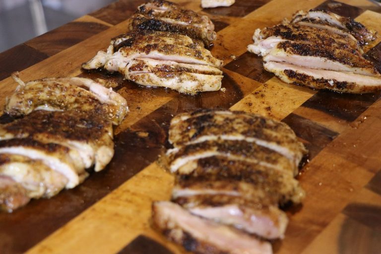 Cut up cooked chicken thighs to desired size