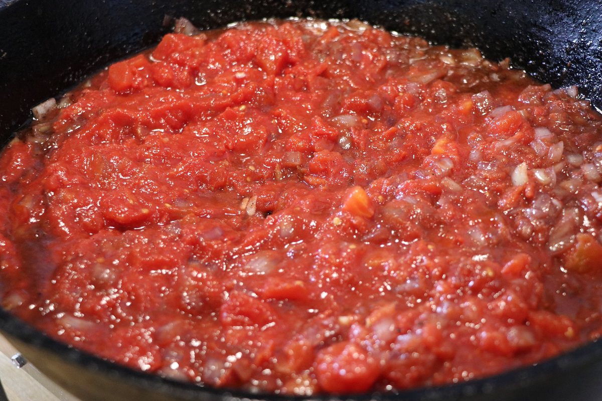 Add tomato, Mediterranean-ish and simmer
