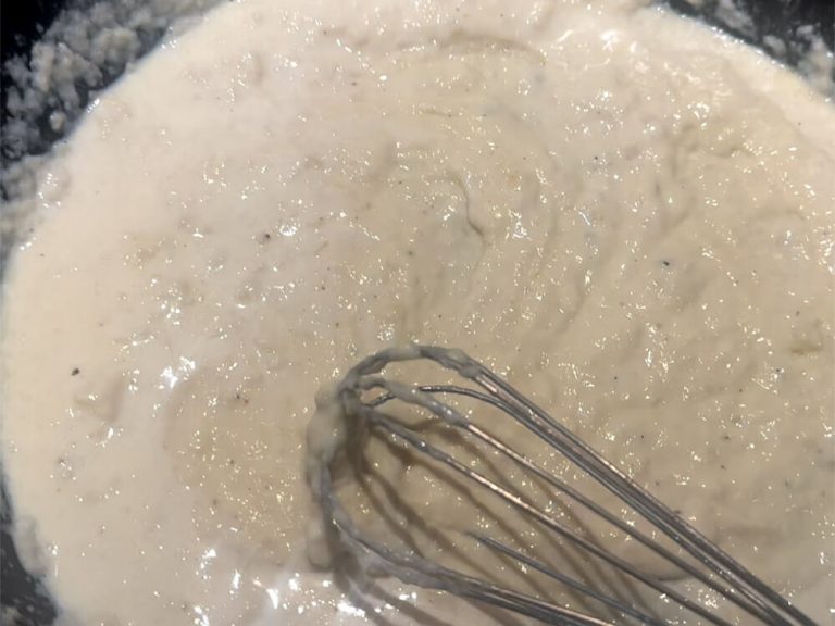 Whisk warm chicken broth until smooth