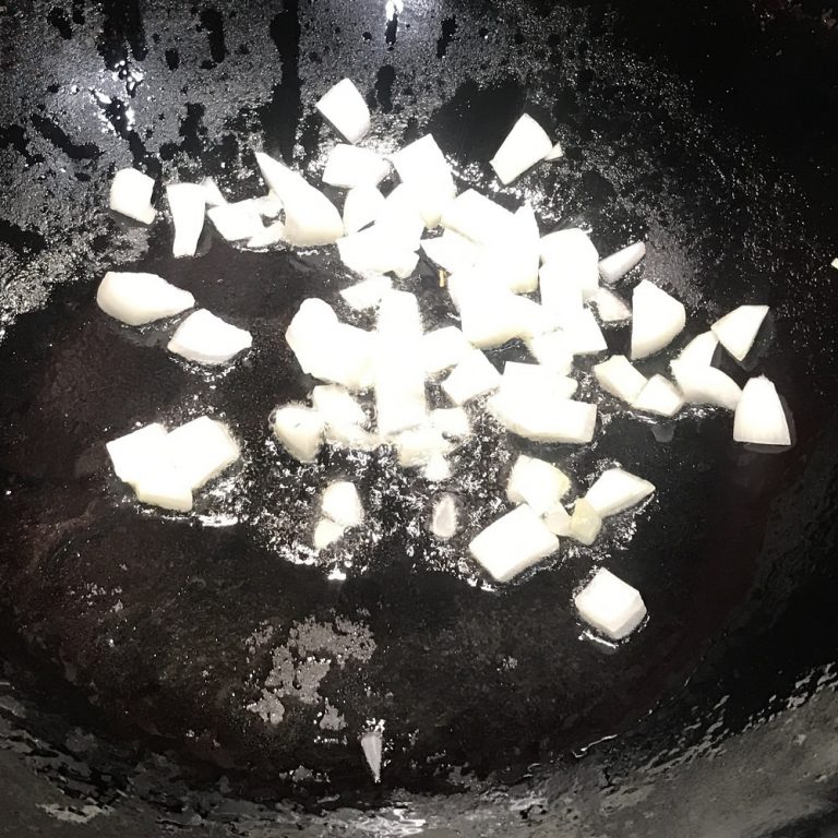 Add onions to wok and stir constantly until fragrant, about 30 seconds
