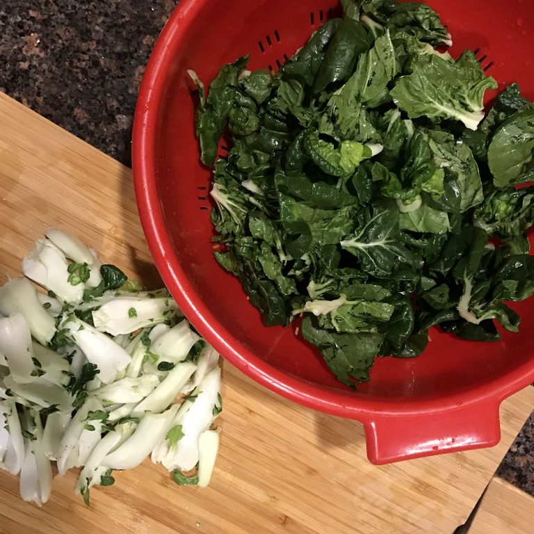 Separate bok choy leaves and stems