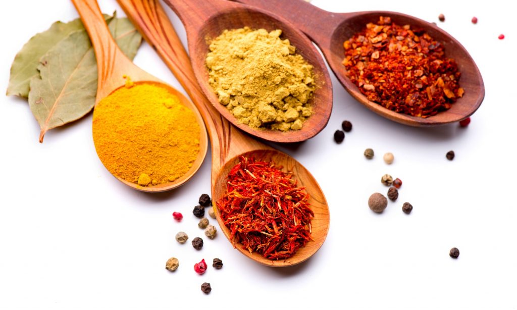 Colorful seasonings on white background