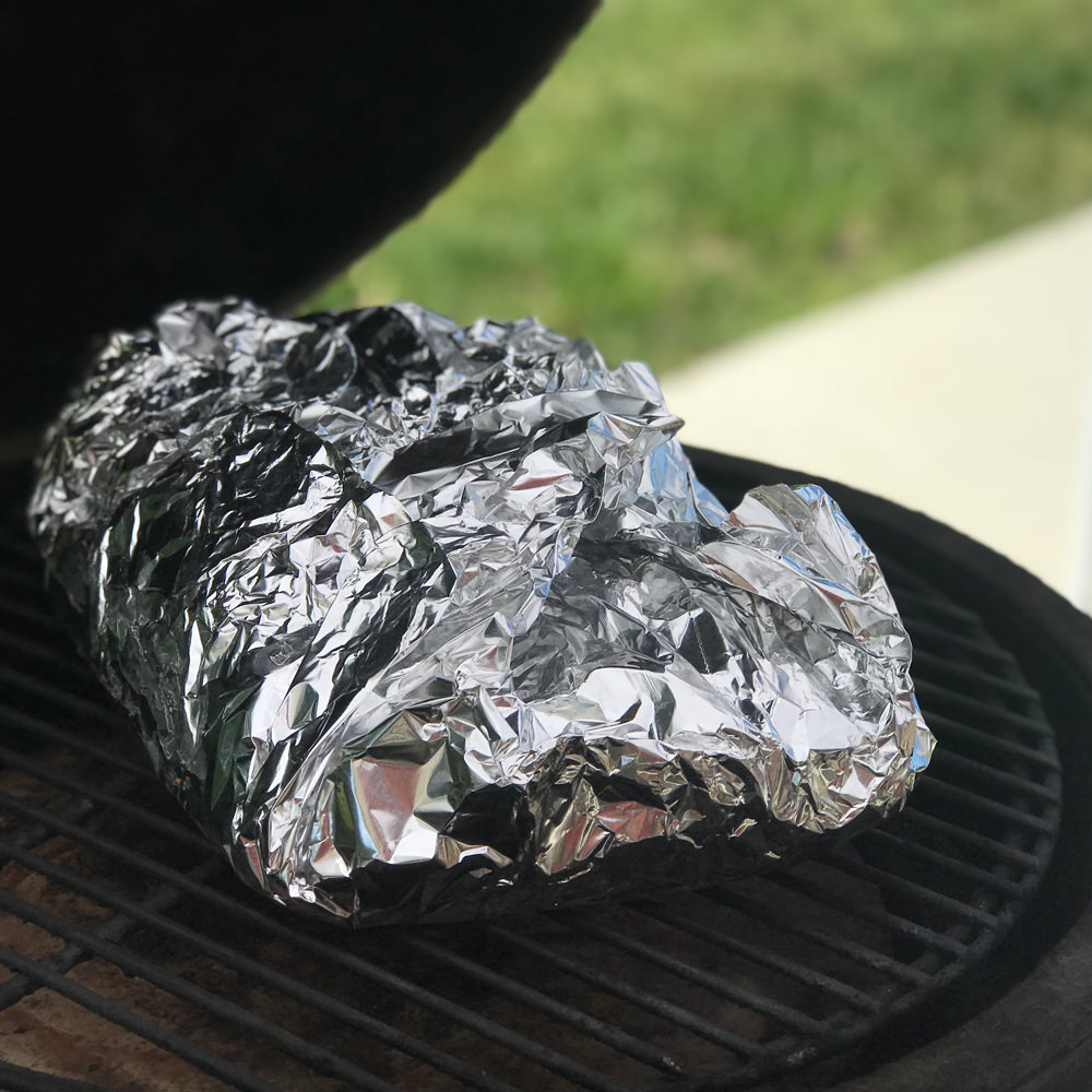 Return tightly wrapped brisket to smoker, and cook for 2-4 more hours. Be careful not to puncture foil and lose your liquid. Begin checking tenderness when internal temperature in the thickest part of the flat is 195°F