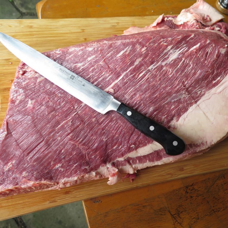 With sharp knife, trim off all membranes, silver skin, and globs of fat off of the top side of the “flat”