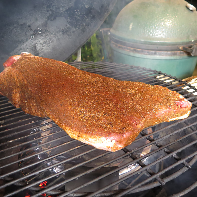 Ensure that your smoke is clean and sweet smelling. Place brisket on cooker, fat cap down and with the “point” end toward the hotter part of your cooker