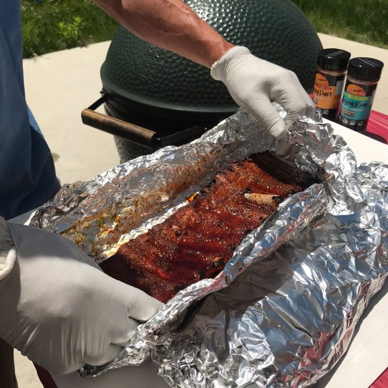 After 1 hour, open foil and turn ribs over to be bone side down