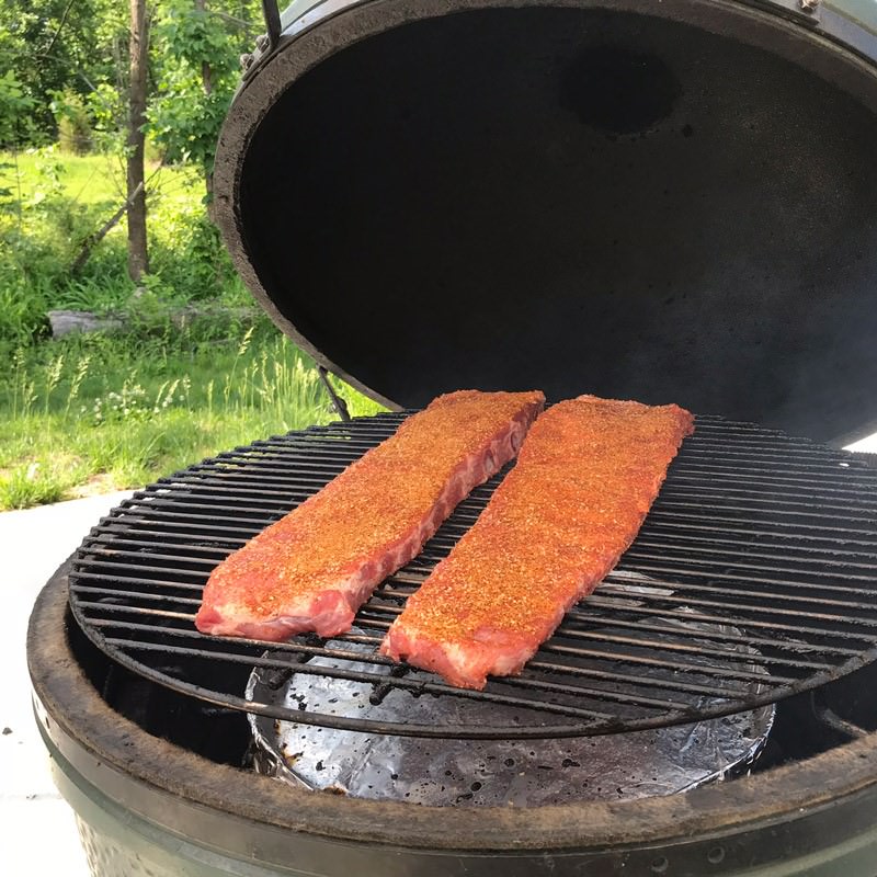 When smoke has turned blue and thin, place ribs on your grill/smoker meat side up
