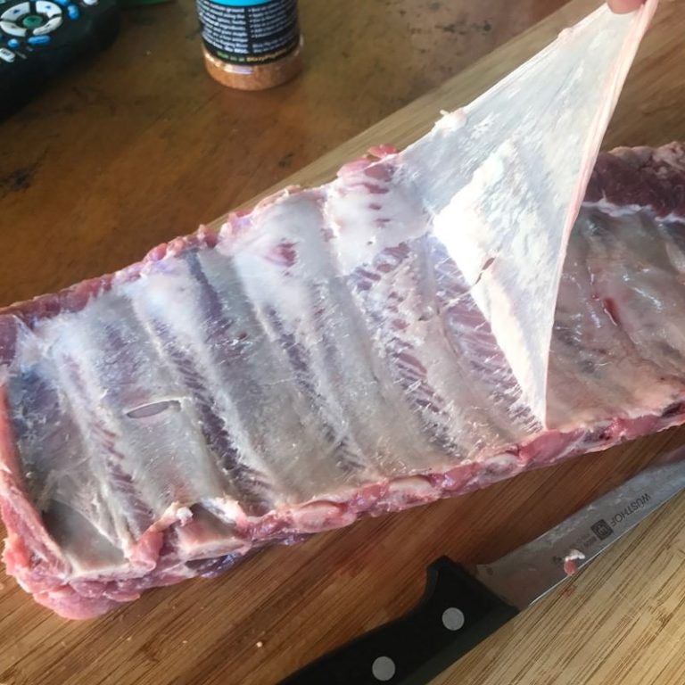 Remove membrane (a paper towel helps to get a grip on it)