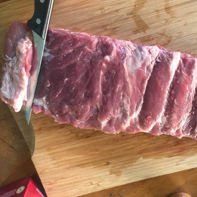 Trim excess fat from meat side of ribs