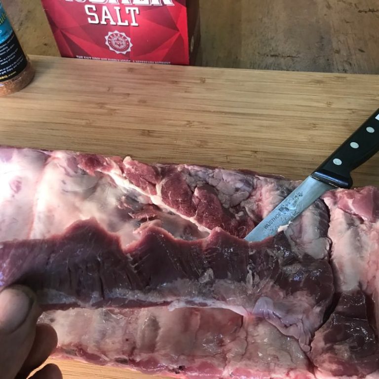 Trim flap from bone side of ribs