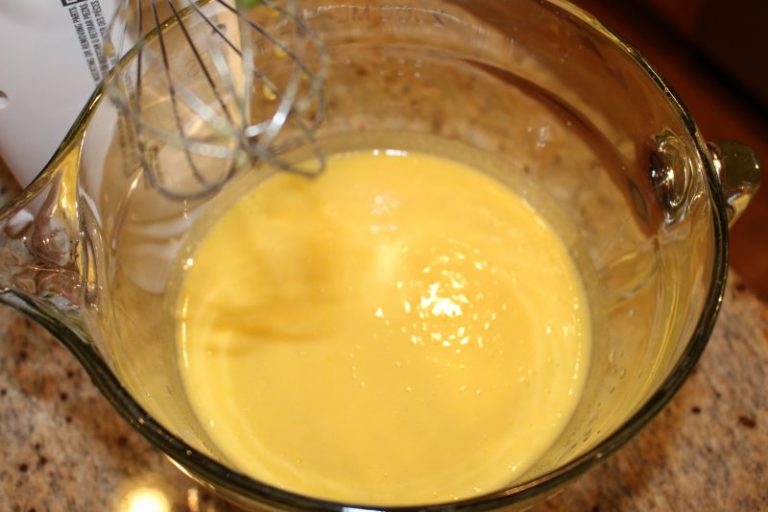 Beat egg yolks with sugar until color turns pale yellow