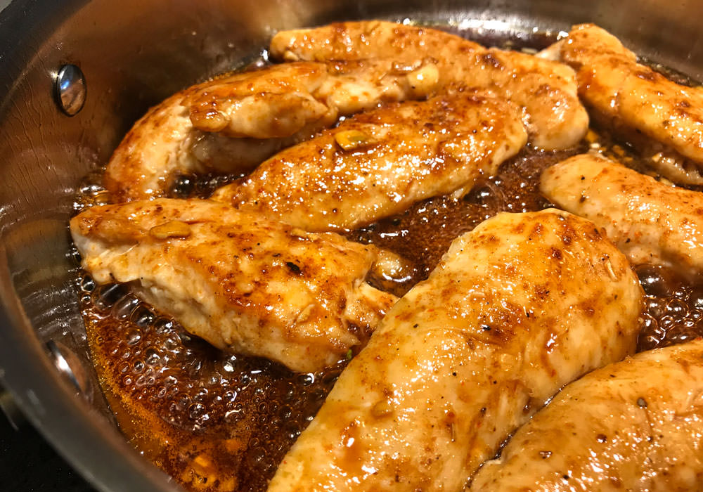 Pour the sauce over the chicken. Simmer uncovered, stirring occasionally, until the sauce thickens and the chicken is cooked through