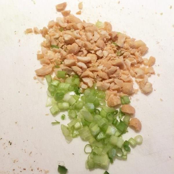Chop peanuts and green onion for garnish