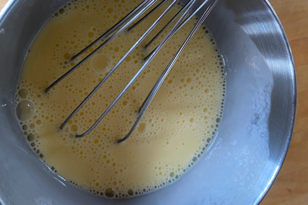 Whisk eggs and half-and-half until frothy