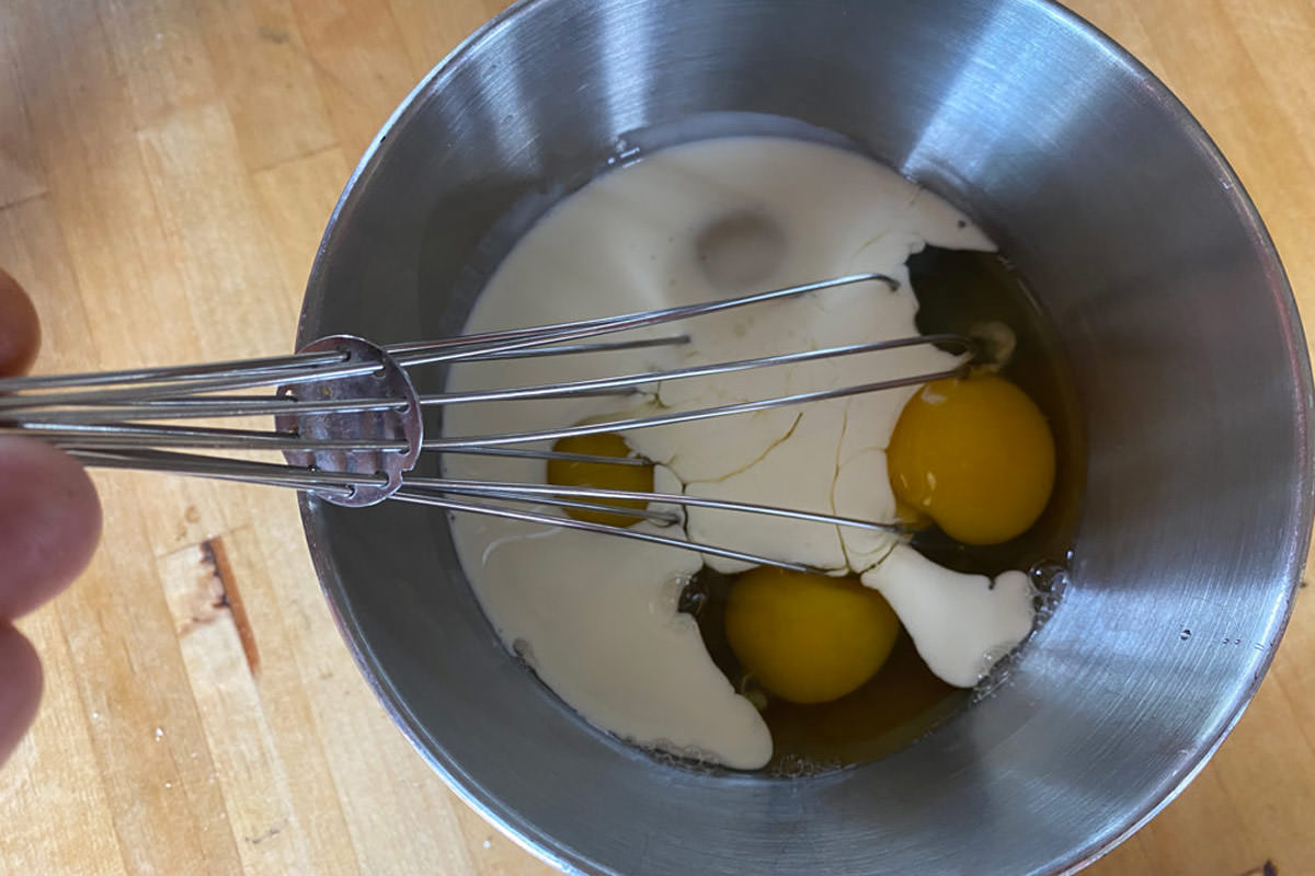 Whisk eggs and half-and-half together