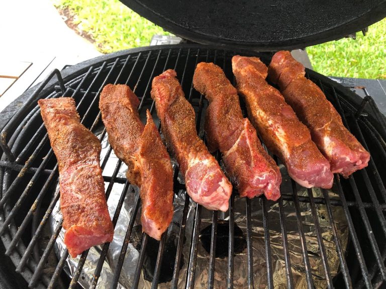 Season ribs with Swamp Venom and grill
