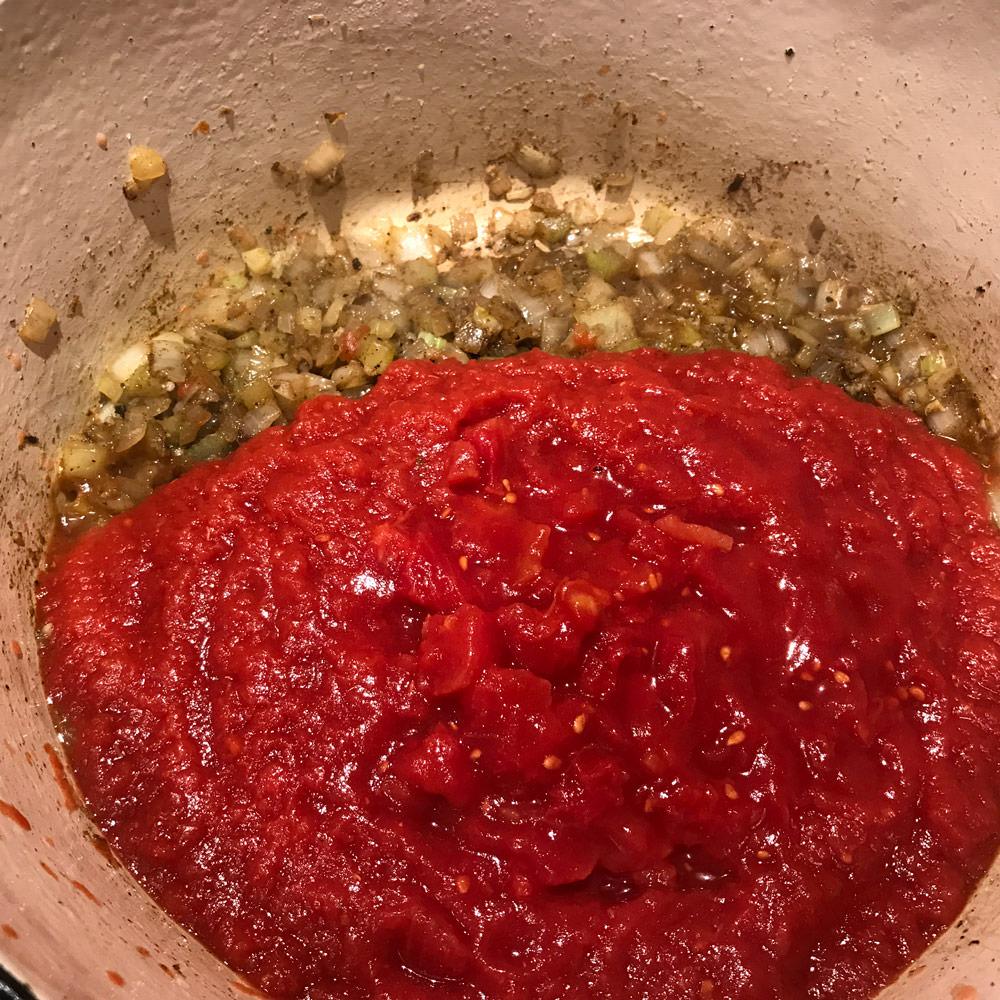 Add tomatoes, sugar, Mediterranean-ish and simmer