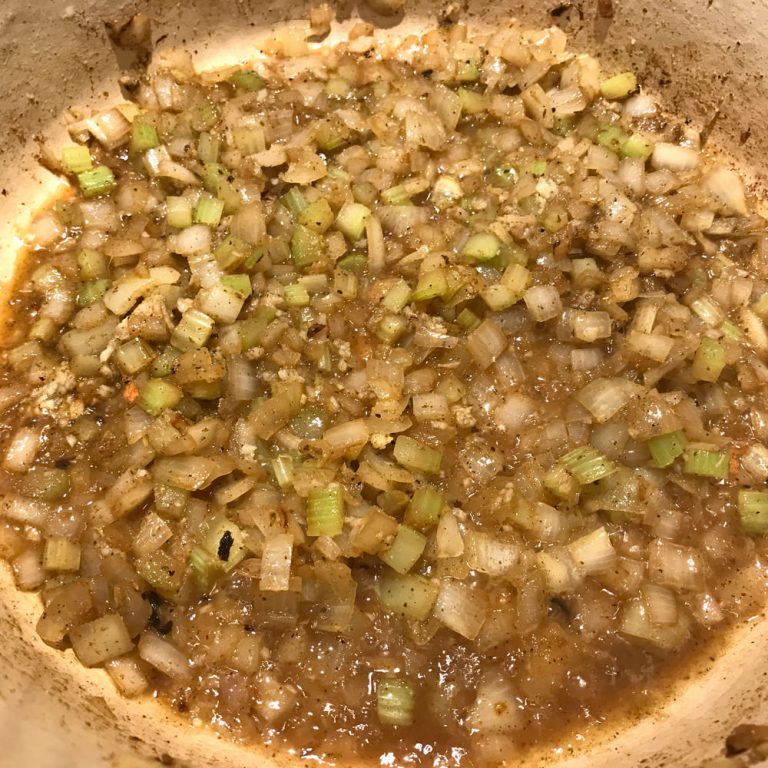 Saute garlic then add wine