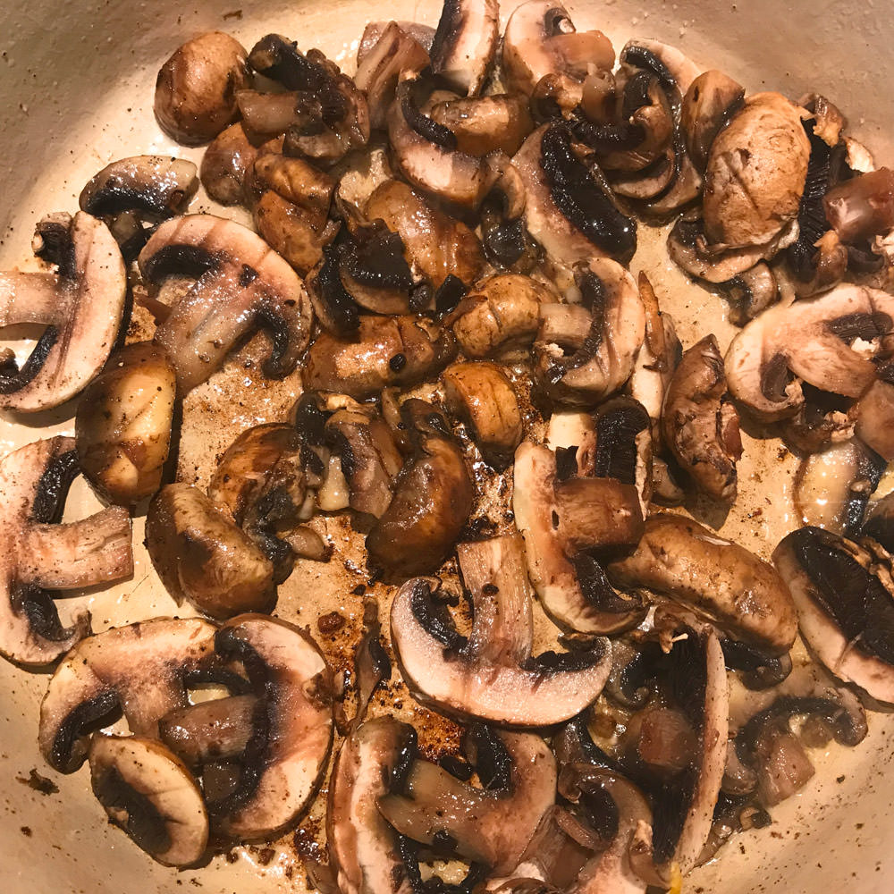 Sauté mushrooms on medium heat