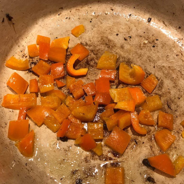 Sauté bell pepper for a few minutes until they start to brown