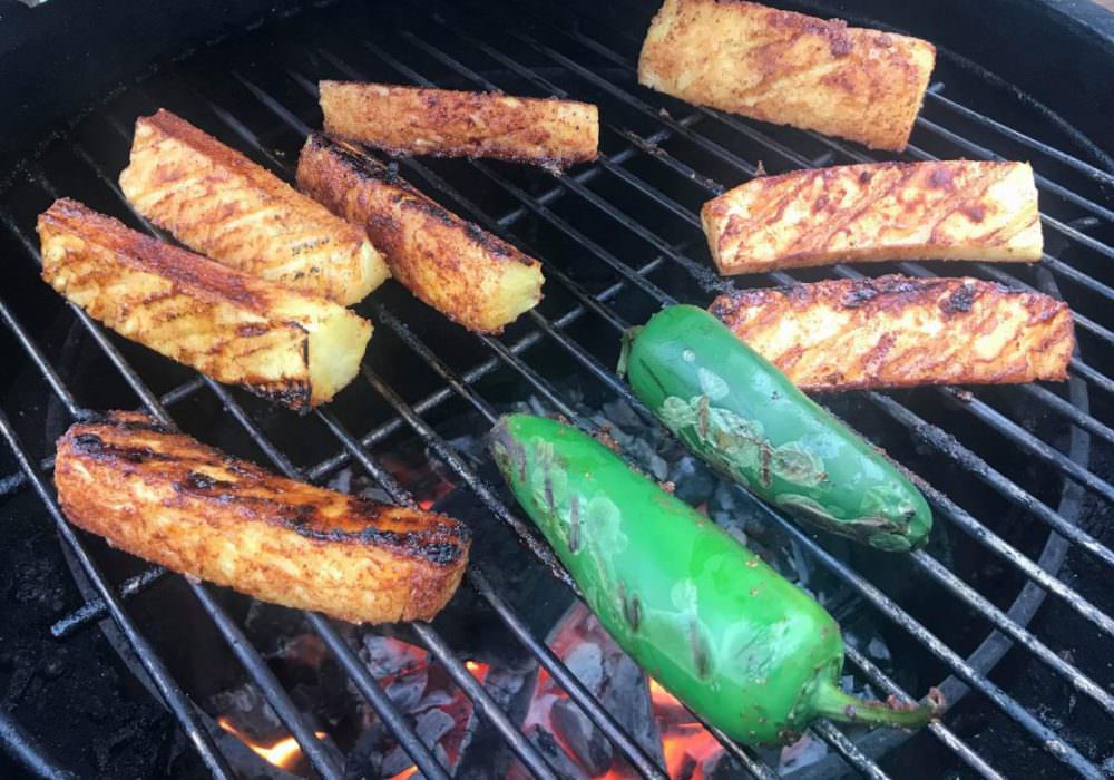 Grill jalapeños at the same time as the pineapple
