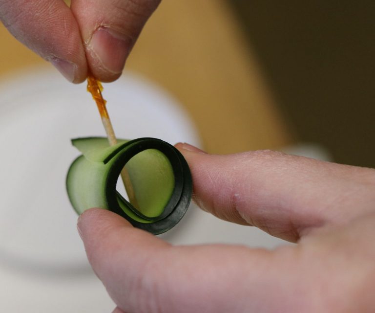 Roll cucumber slices into tight curls