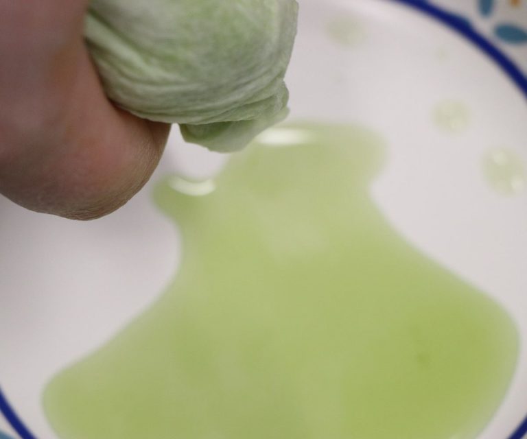 Squeeze out excess liquid