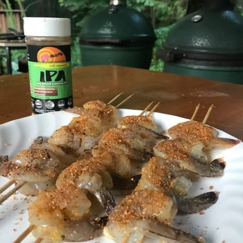 Thread shrimp onto skewers, using two parallel skewers to keep them from spinning