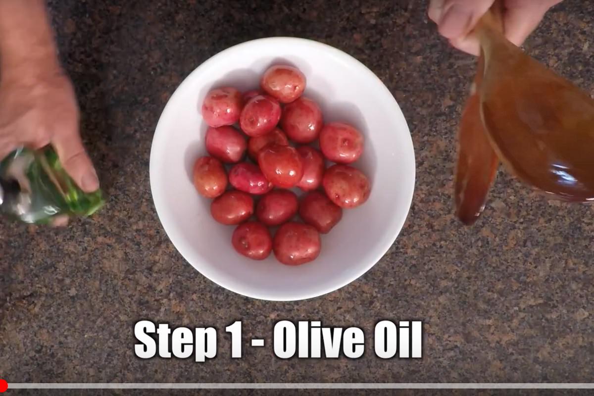 Coat potatoes in olive oil