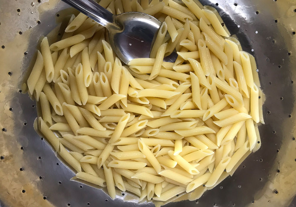 Cook pasta until just shy of al dente, drain and set aside