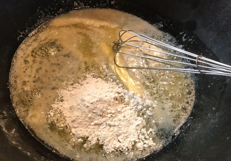 Melt butter in a large stock pot over medium-high heat. Whisk in flour until fully incorporated