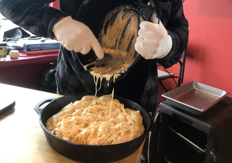 Fold in pasta, and transfer everything into a large cast iron skillet. Smooth it all out with the back of the spoon