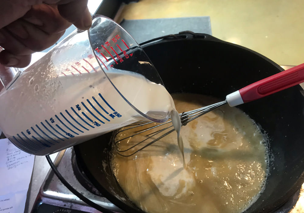 Slowly add the beer/half-and-half mixture while whisking