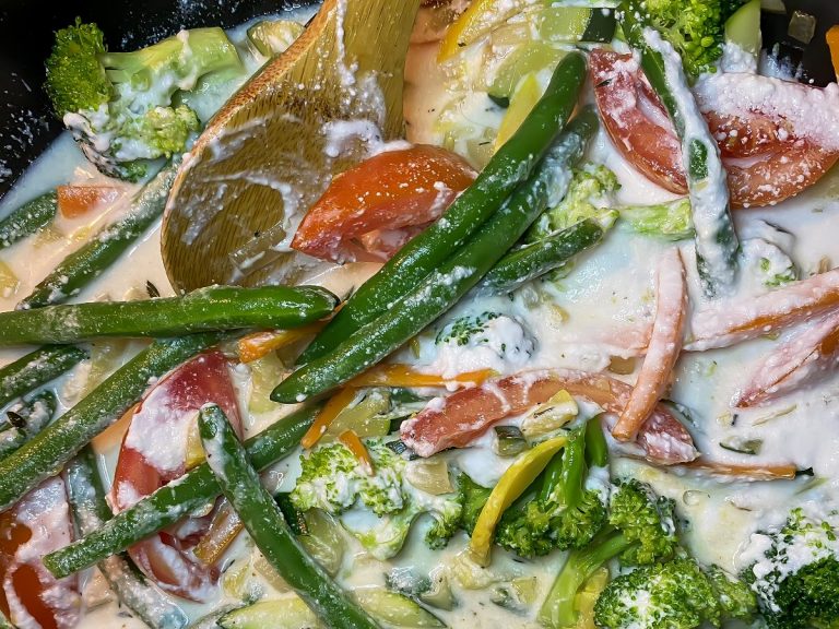 Simmer vegetables in coconut milk