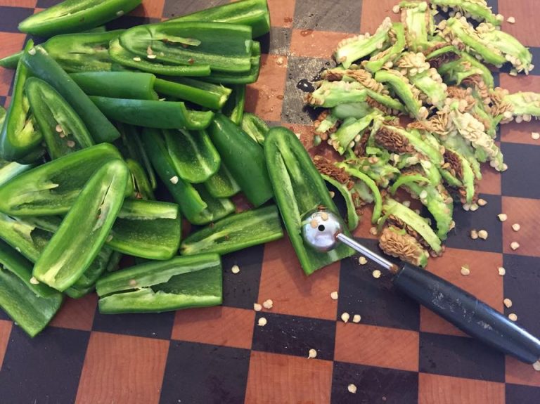 Seed peppers using a melon scoop