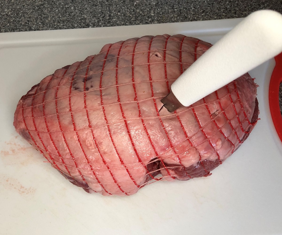 Stab 6-8 deep Xs into the lamb